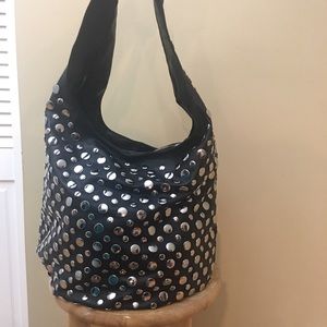 Black purse covers in silver studs